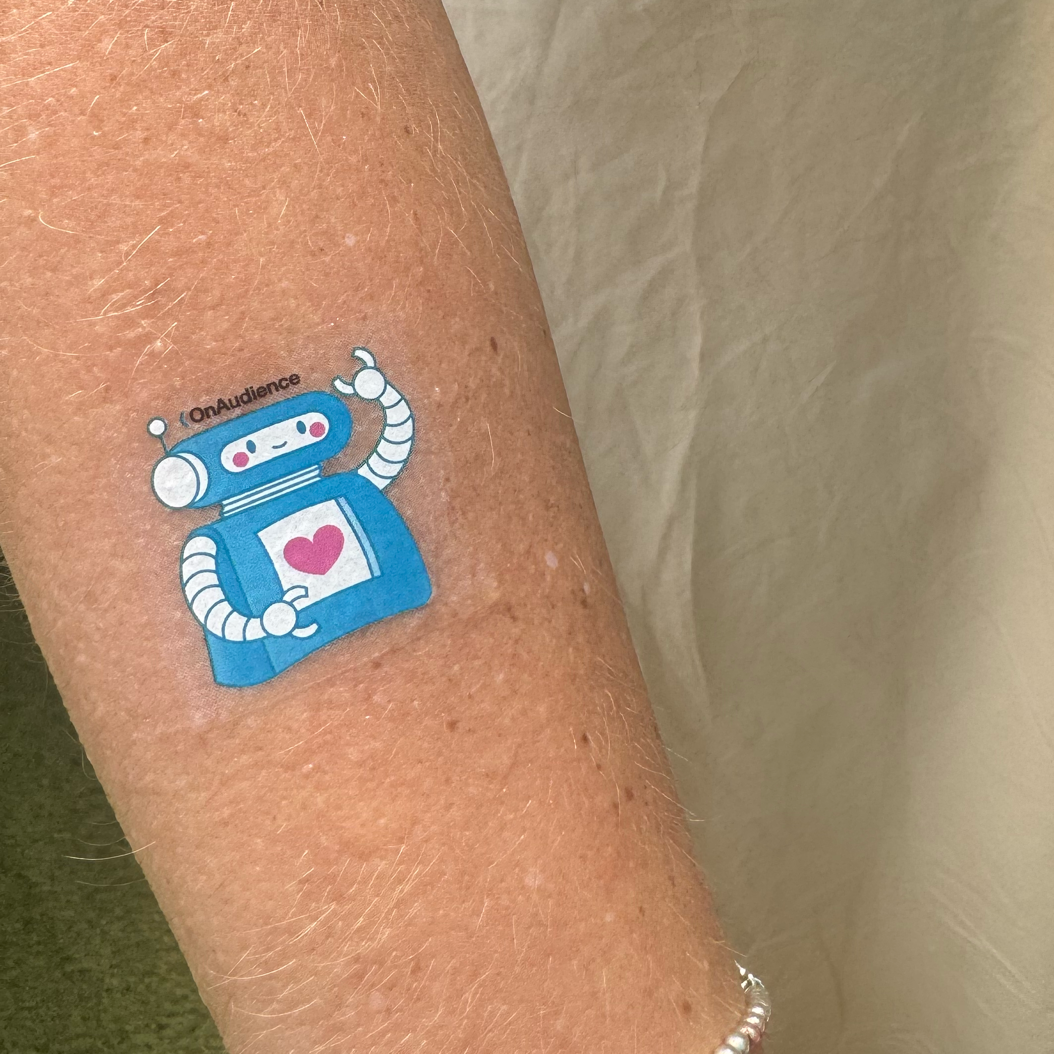 OnAudience temporary tattoo on attendee's arm