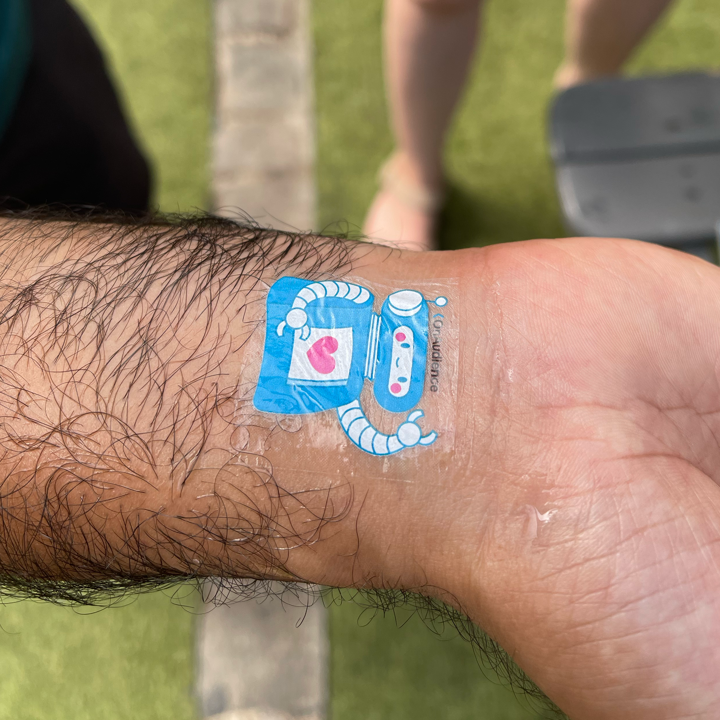 OnAudience temporary tattoo on attendee's wrist